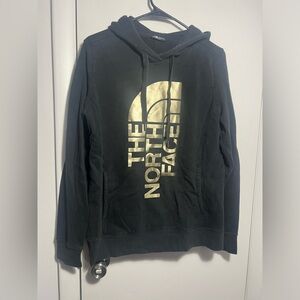 The North Face Black Hoodie with Gold Graphic